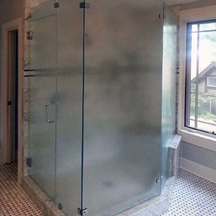 Frameless shower enclosure in satin-etched specialty glass