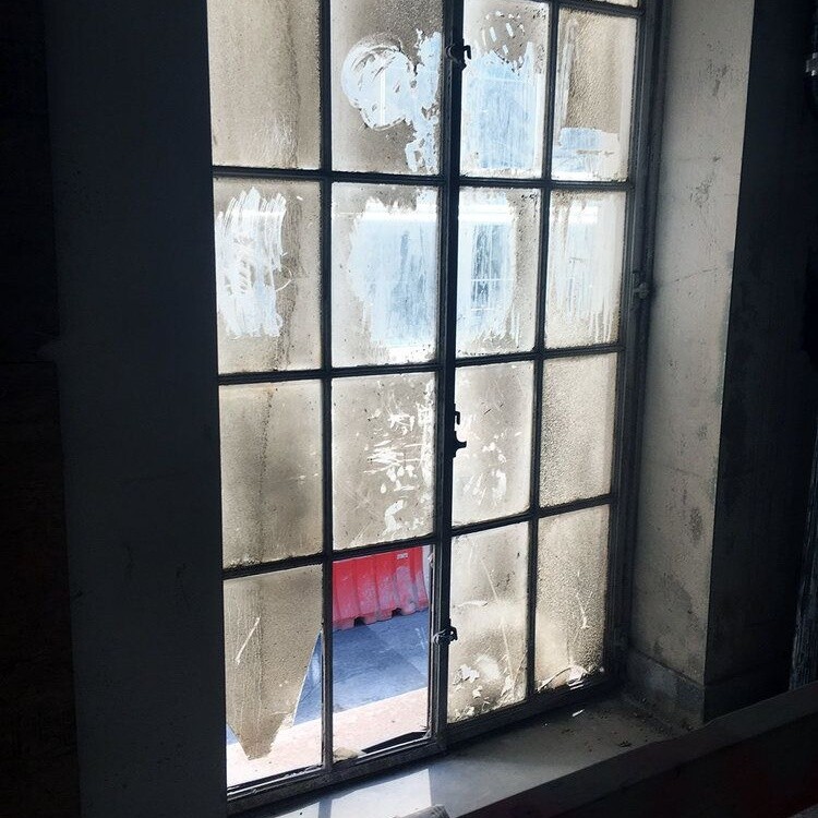 Original steel-framed window with aged glass