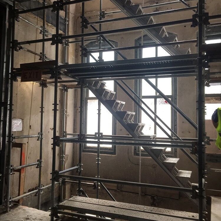 Temporary stair tower and shoring inside the building