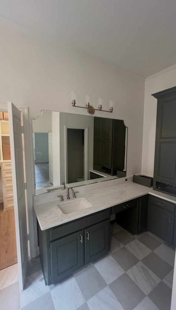 Custom vanity mirror with beveled radius corners over a double vanity in Richardson, TX