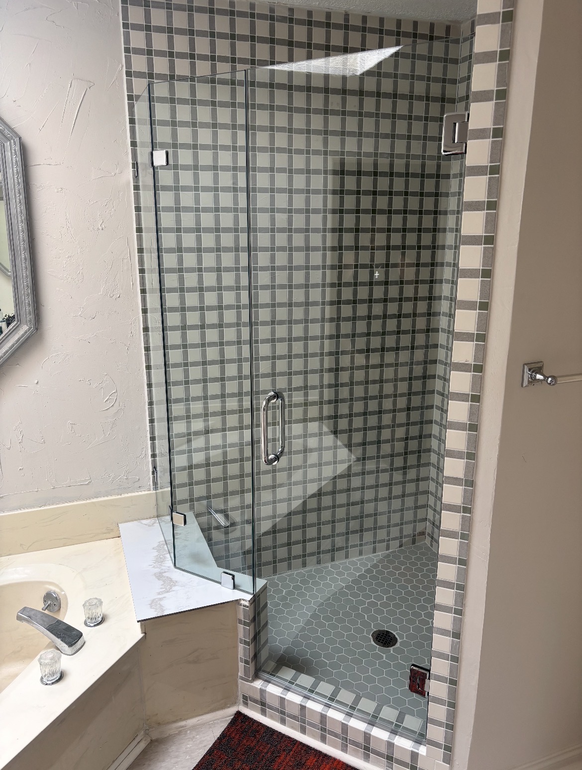 Frameless neo-angle glass shower enclosure with chrome hardware in Mesquite, TX