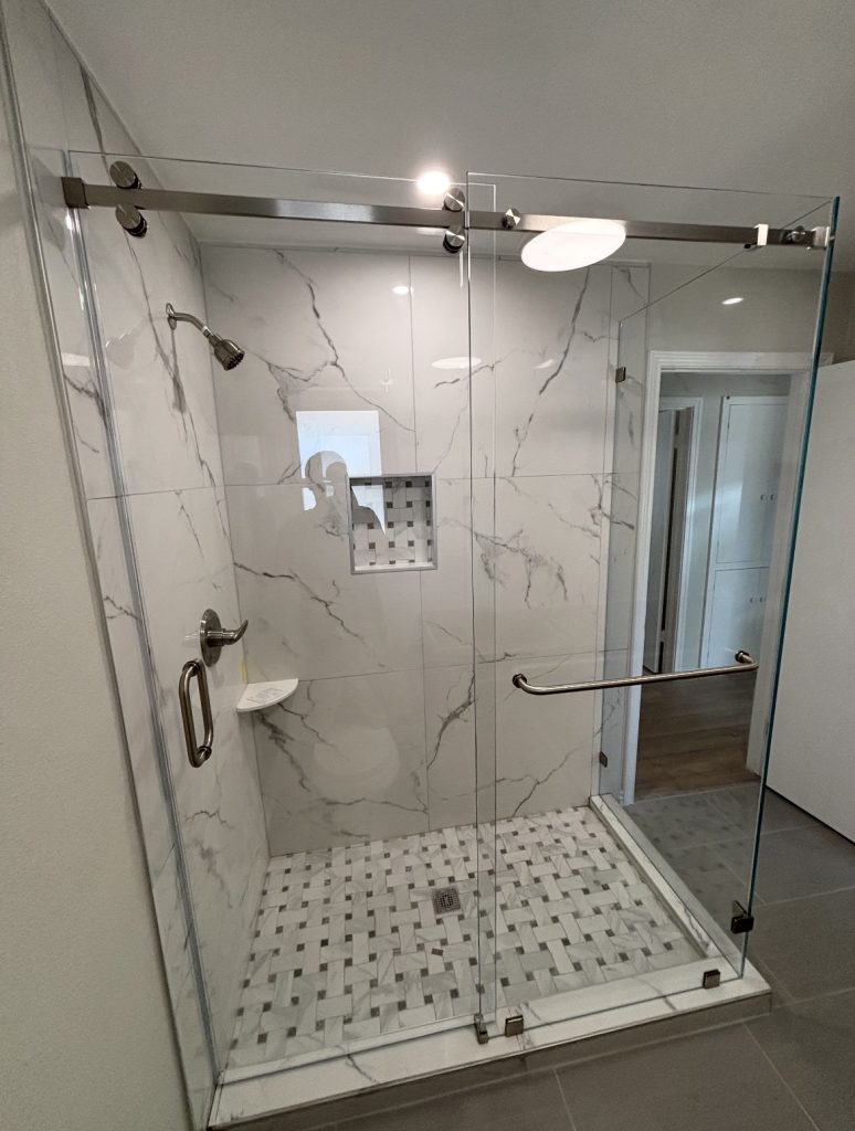 90-degree Serenity sliding shower door with low-iron glass and brushed nickel hardware in Richardson, TX